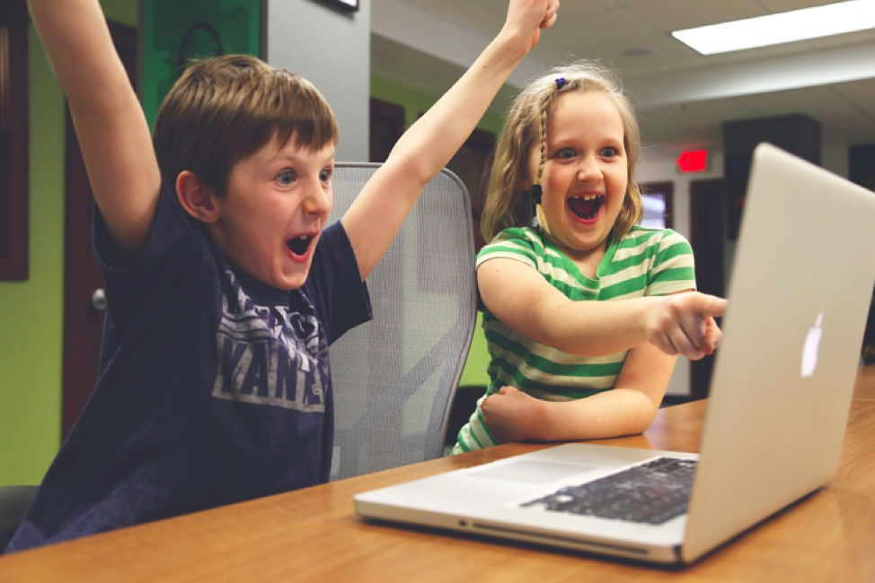 Happy Children Looking at Laptop