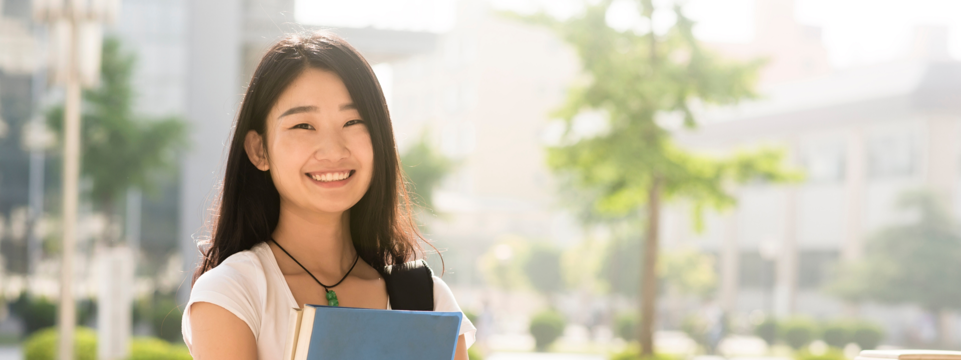 Happy college student with backpack