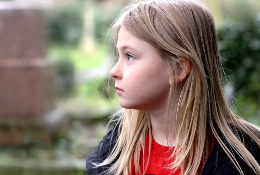 Child looking off to the distance mental health