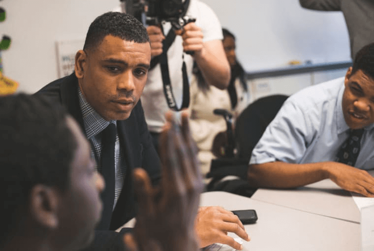 A celebrity engaging students in a classroom with EVERFI.