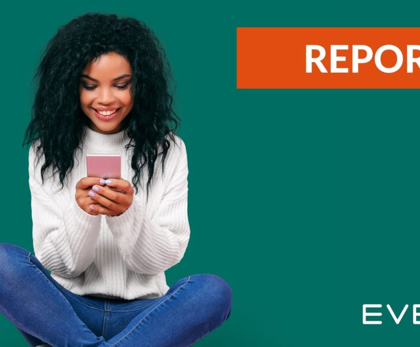 young woman smiling at phone