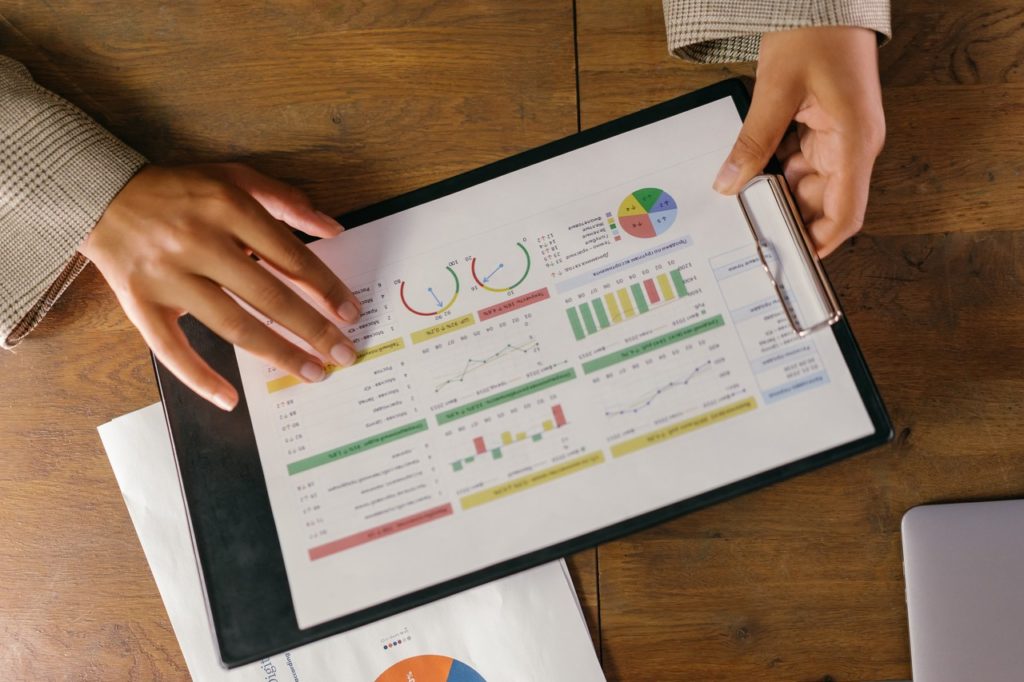 person holding a spreadsheet