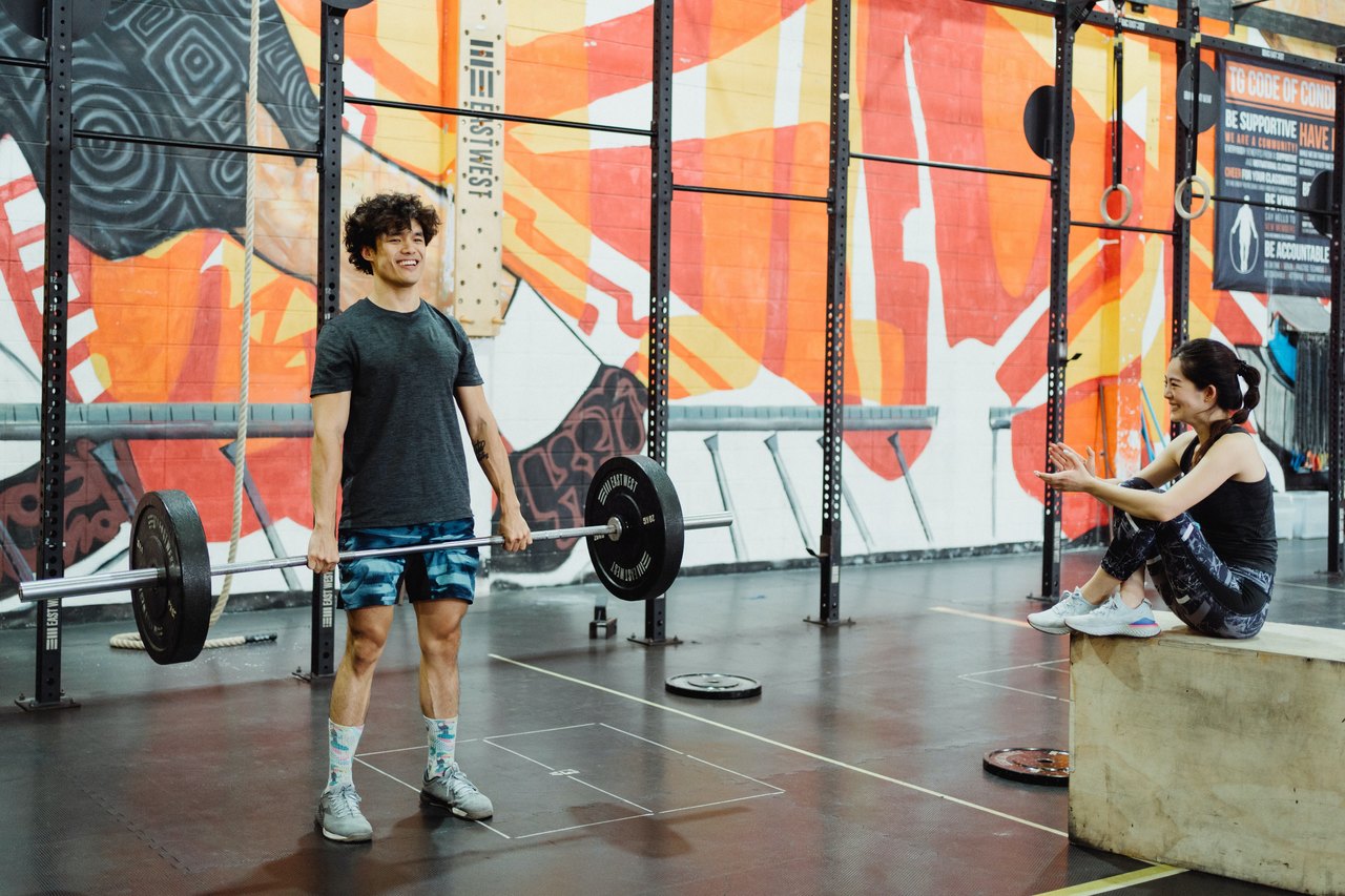 teenage boy lifting weights