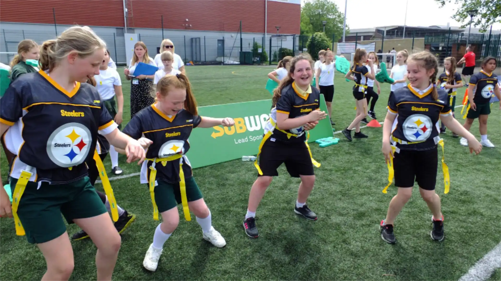 Children dancing in Pittsburgh Steelers shirts