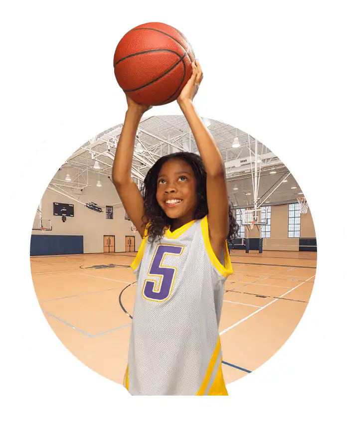 Child preparing to shoot basketball