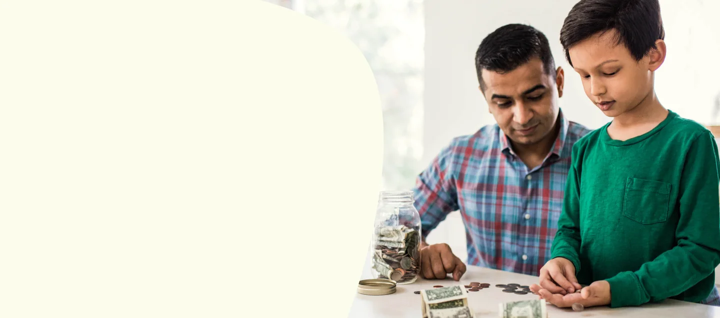 Father and son counting spare change together