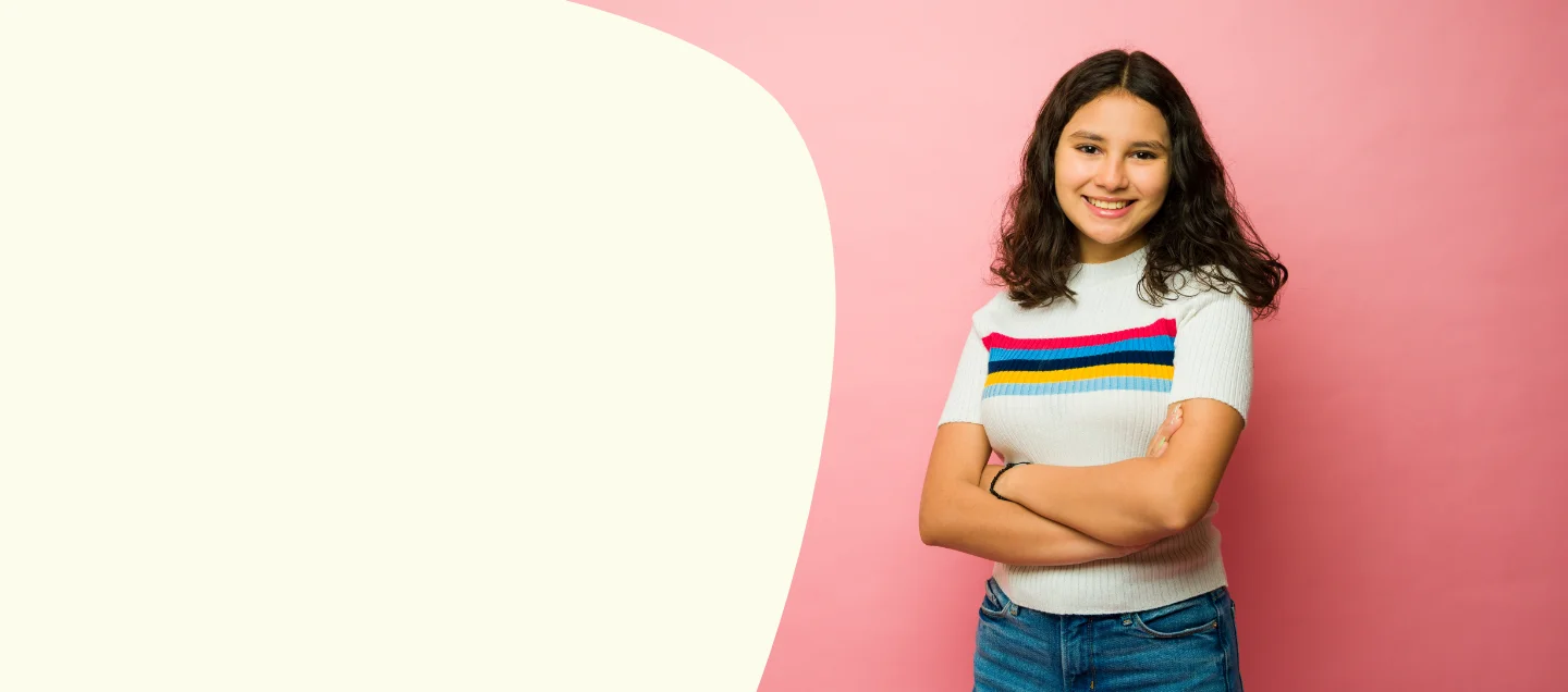 Young woman smiling with arms crossed
