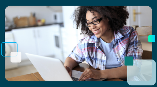 A student or teacher happily learning or working on a laptop, relating to educational insights