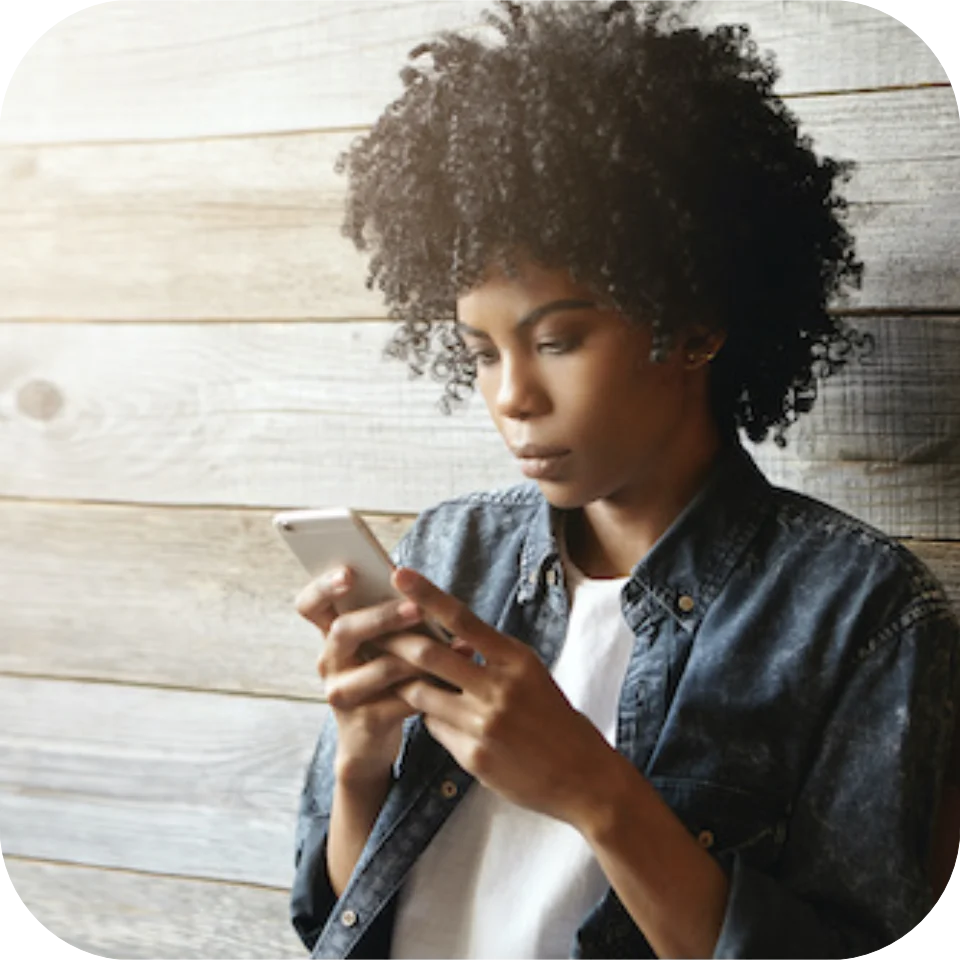 Young woman looking at mobile phone