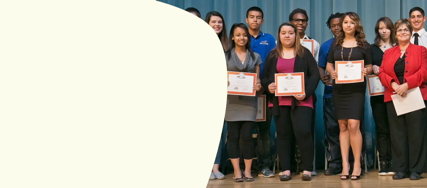 Student group holding diplomas