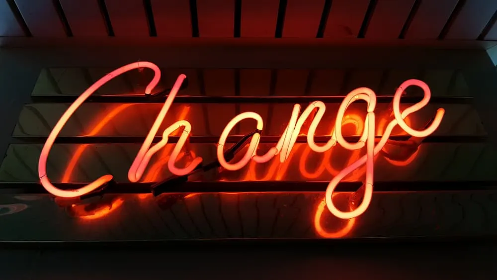 Neon sign glowing with the word "Change."