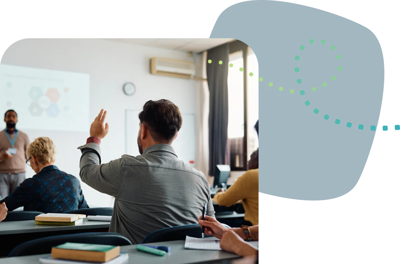Adult student raising hand in classroom